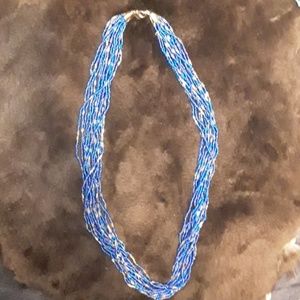 16 strand beaded blue / gold tone stateme necklace